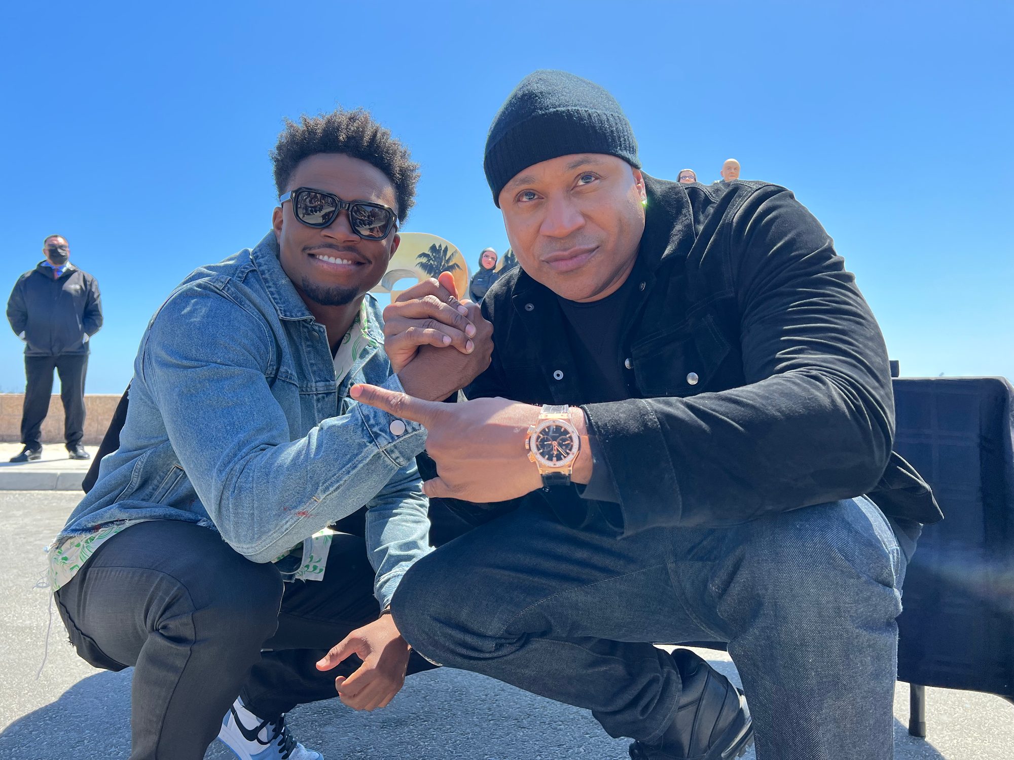 Caleb Castille and LL Cool J outdoors